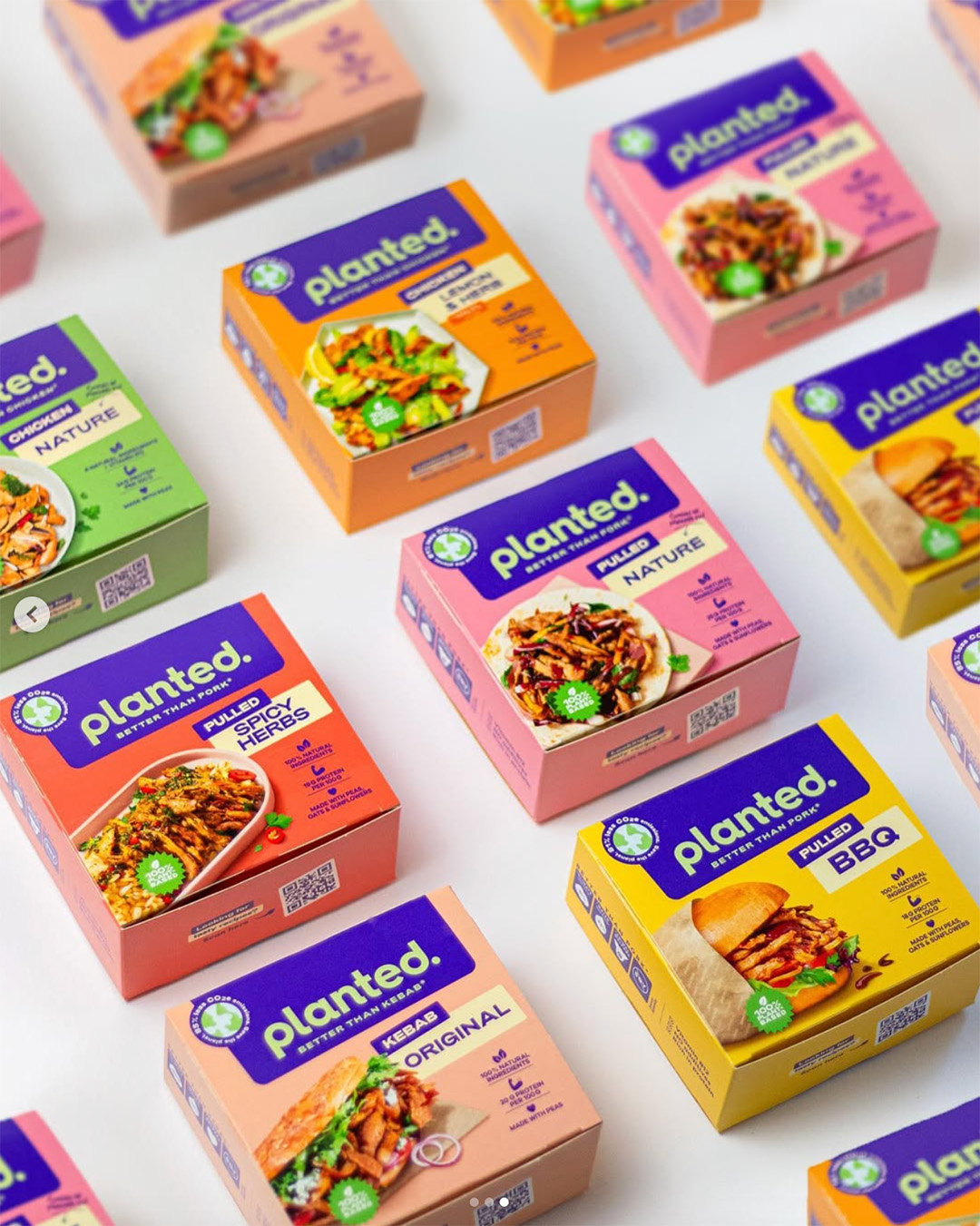 Planted packs of pulled and kebab products laid out at an angle on a white surface